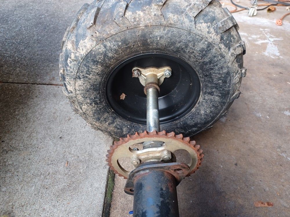 atv 125 Axle, wheels and swing arm.