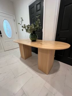 Beautiful oval dining table with storage space in each side legs