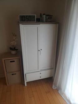 White wood closet with extra drawer