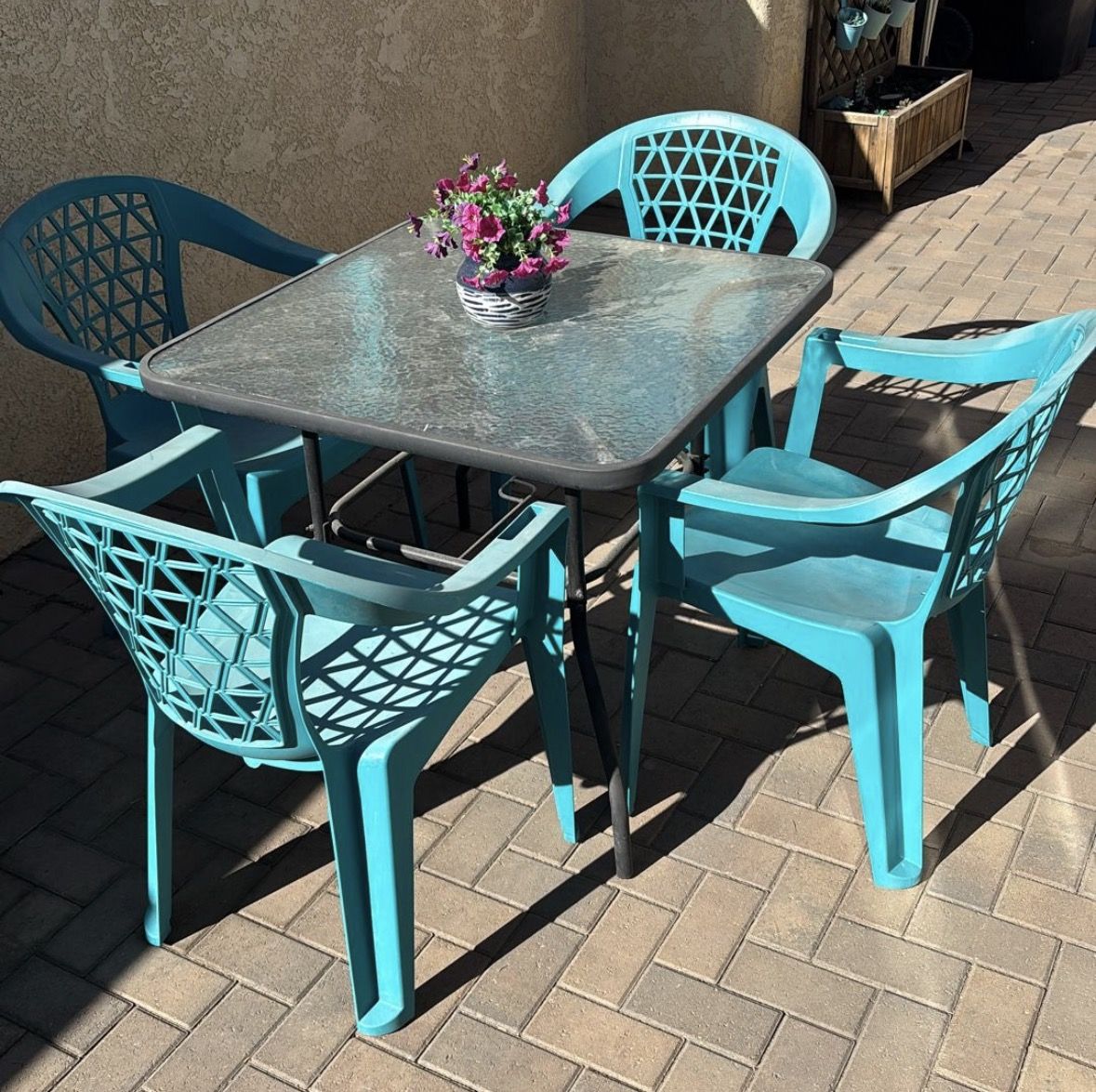 Glass table and blue chairs