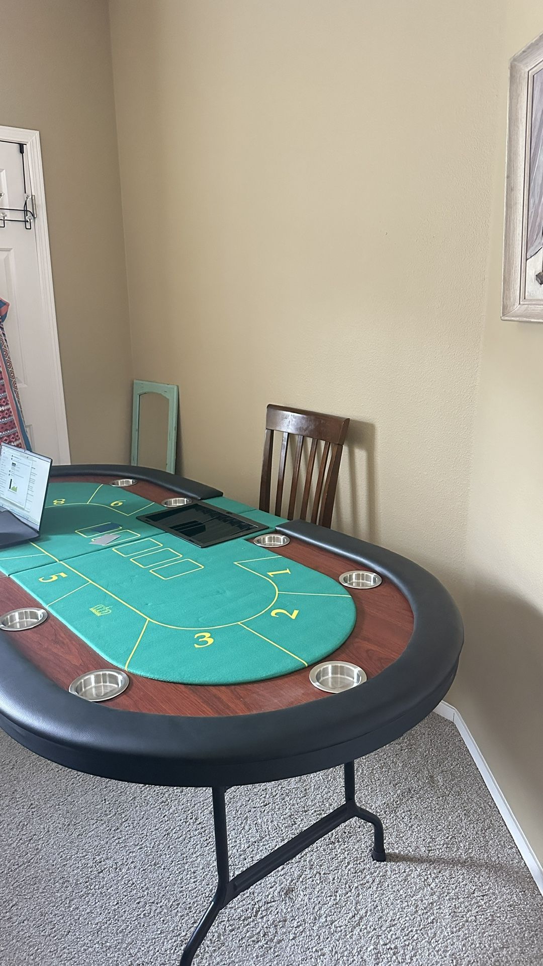 A high-quality new poker table that was once used to record training videos