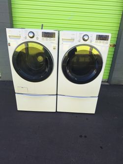 LG SET WITH STEAM CYCLE WASHER 4.5 and GAS DRYER 7.4 CUBFT 27”W WITH PEDESTAL