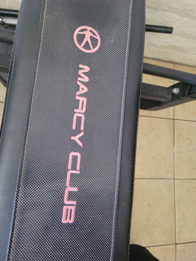 Weight Bench with Barbell and Weights