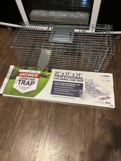 Live capture trap for raccoons, marmots, and other large animals.
