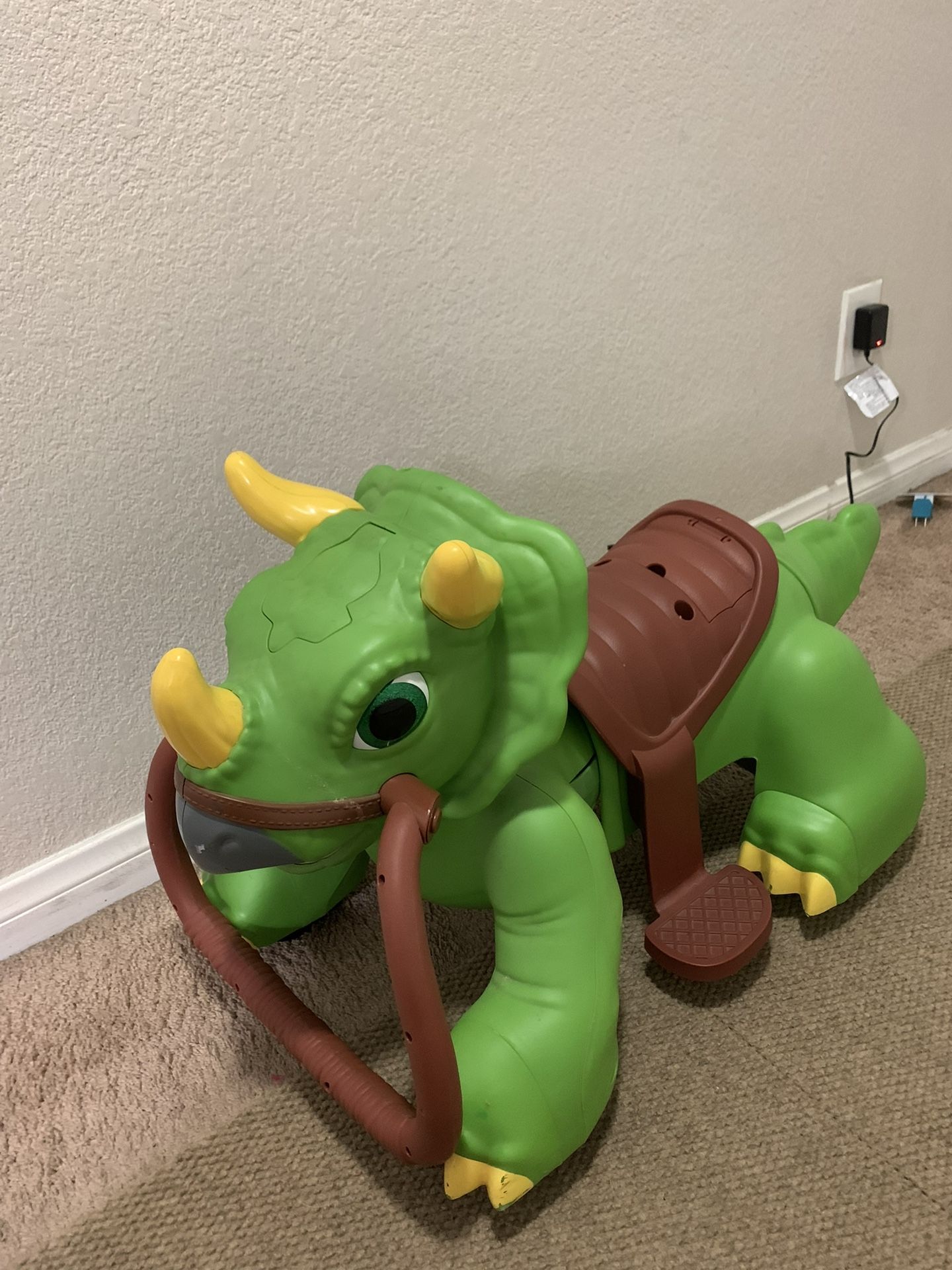 Rideamals Dinosaur Ride-On Toy by Kid Trax, powered rechargeable toddler, boys or girls, toddler
