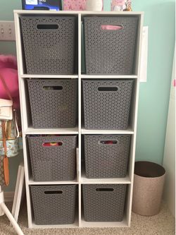 Tall storage shelf with bins