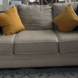 Two Matching Beige Sofas 