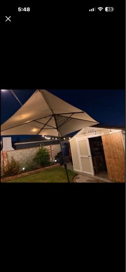 Hampton Bay 6.5 ft. x 10 ft. Aluminum Market Auto-Tilt Patio Umbrella in Putty Beige