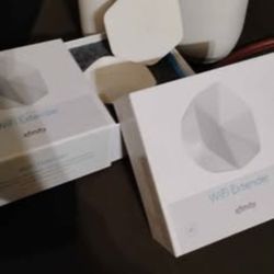 Two Xfinity Wi-Fi Boosters And Two Xfinity Pro Extenders