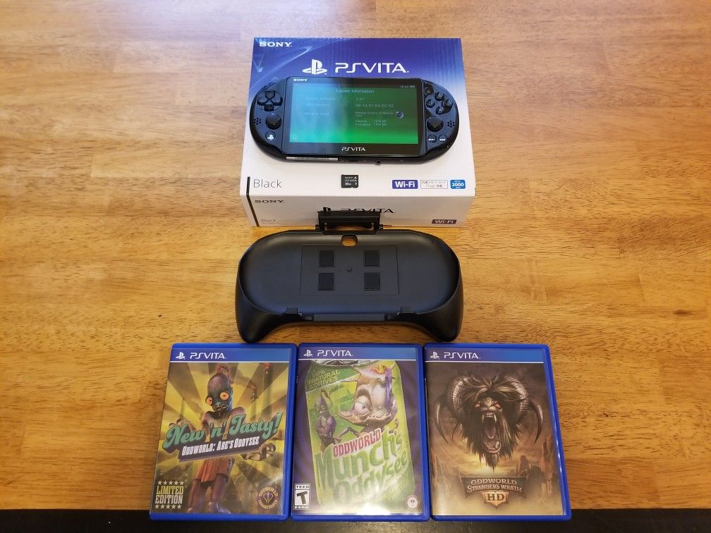 PS Vita CIB with 32 GB memory card, grip + extras