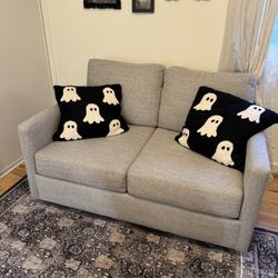 grey living spaces couch 