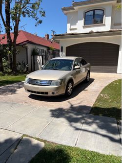 Ford Taurus tan sedan