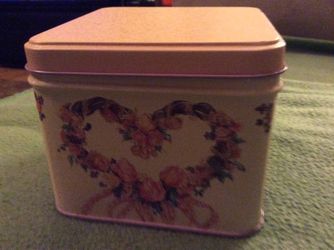 Vintage pink tin with flower wreath design