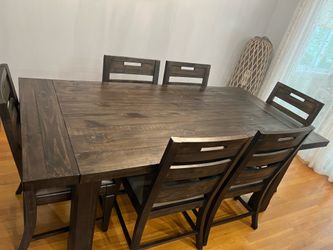 Dark wood dining table with 2 leaves & 6 chairs