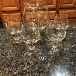 Vintage Brandy Siftner With 4 Brandy Cups.  Etched Floral Design .  Size Brandy Siftner 7 inches tall the cups are 4 inches tall.  Preowned Excellent 