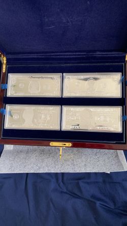 I got 12-Ounce,s Of Silver, It Is ($1-$100,000) Silver Currency Proof Set 12-Piece Presentation Set. Each Piece Boasts a Total Surface Area Of 15.