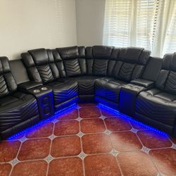 POWER RECLINING SECTIONAL WITH SPEAKERS, LED LIGHTS, USB PORTS , CUPHOLDERS AND ARM STORAGE 