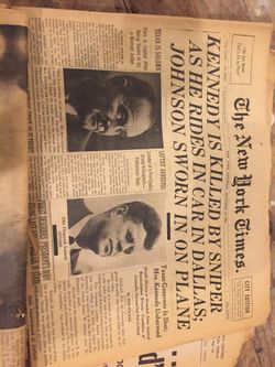 Box of Old newspapers, JFK , Man on moon
