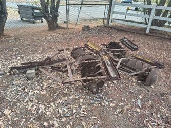 antique tandem disc harrow (often referred to simply as a "disker" or "cultivator"