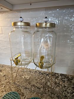 Glass pitchers with stand and black chalk board signs,
