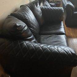 BLACK COUCH , LEATHER, Bed included Inside 