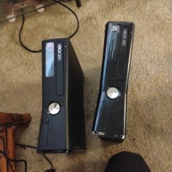 2 Xbox 360s.  PARTS 