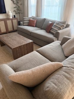 Down feather loveseat and couch with table and pillows