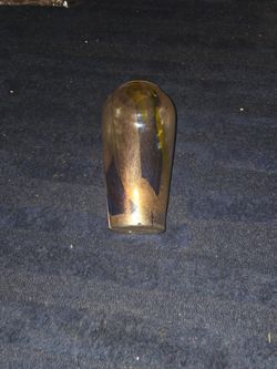 This one0 inch tall iridescent glass art vase .
