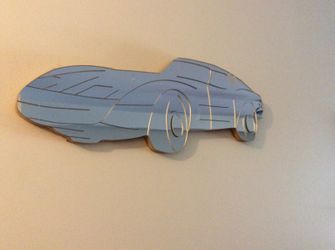 Corvette shaped wall mirror