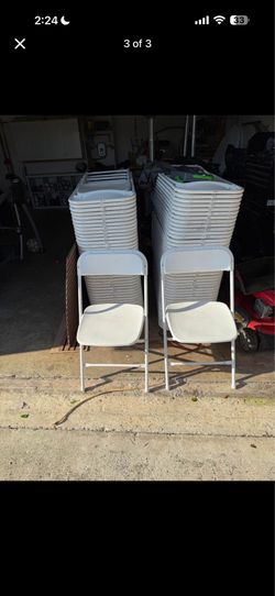 Used white folding chairs s,a,l, e