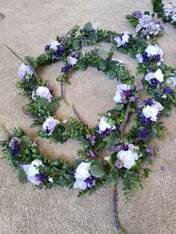 Purple white Artificial Flower Garland wreaths for table decor

Condition is used twice

Measurement
134 Inches long and 4.5 inches wide

Plant Produc