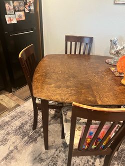 Small wooden kitchen table with 4 chairs