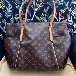 Louis Vuitton And Tumi Centro Padua leather map bag.