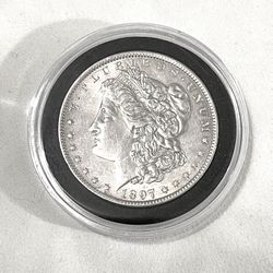 About Uncirculated-AU(50)  1897-P  Morgan Silver Dollar. Valued $86 on US Coin book.