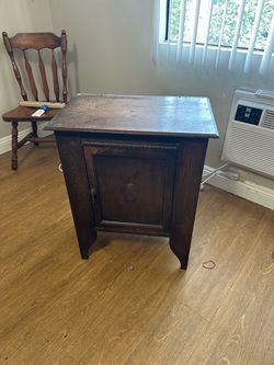 Antique Dark Wood Cabinet with Carved Door