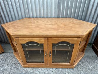 Oak Corner Entertainment Center with Beautiful glass doors.