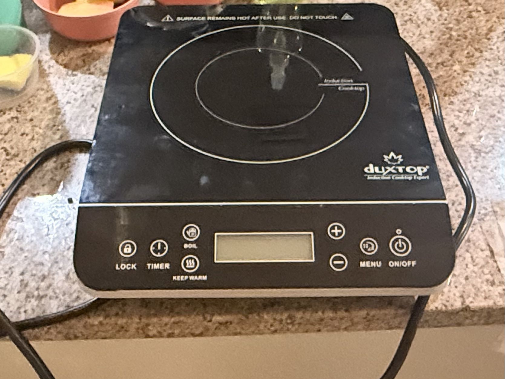 Induction cooktop and a coil burner