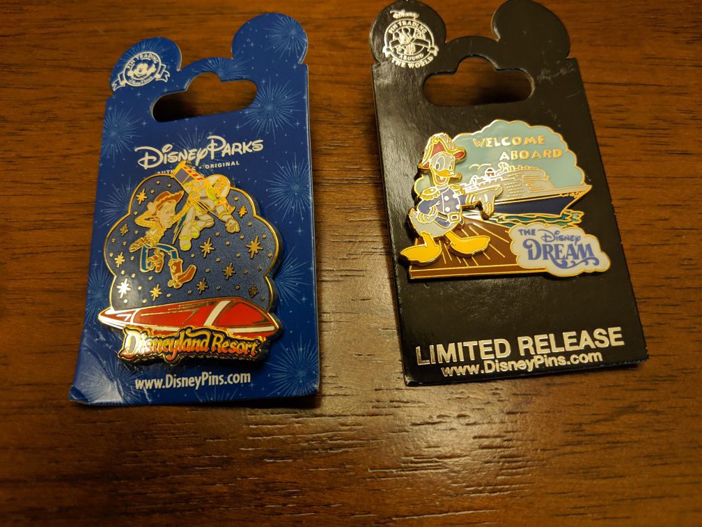 Disney pins 2 total one is Disneyland resort pin featuring Buzz and Woody and the other is limited release from the Disney Dream featuring Donald Duck
