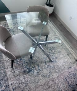 Clear glass table with 2 chairs