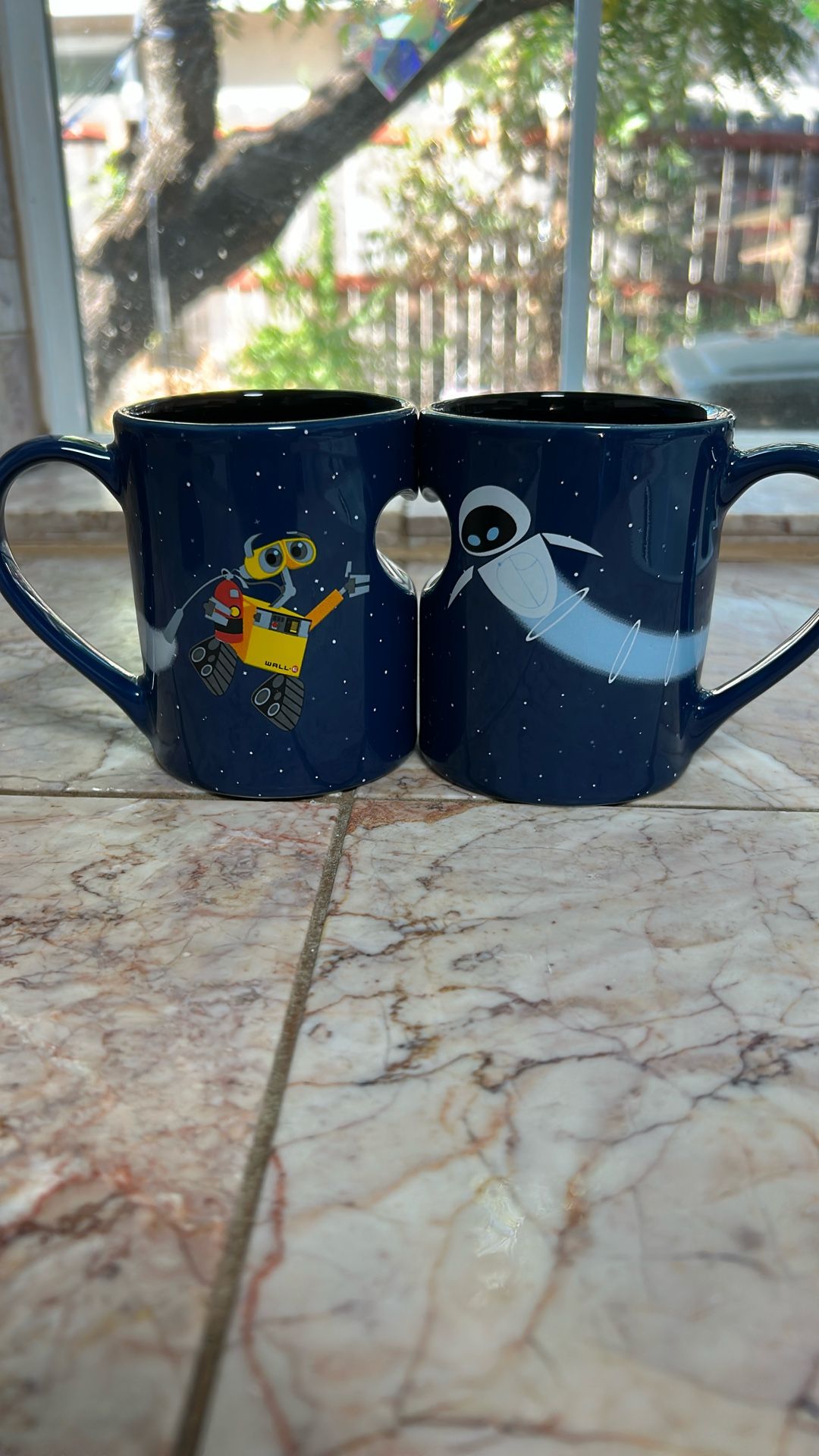 Disney Pixar Wall-E is in her coffee mugs