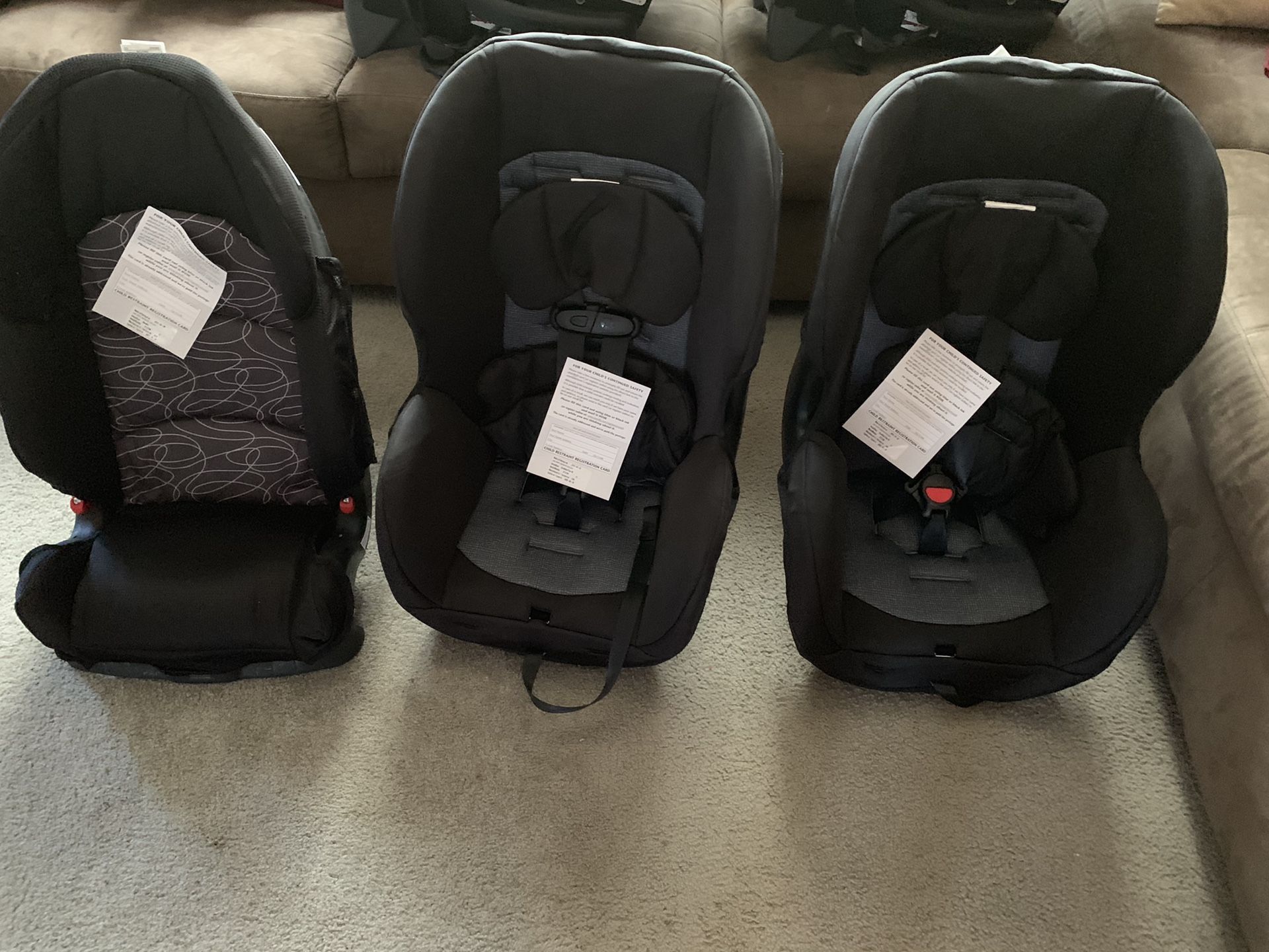 2 car seats and one booster seat evenflo