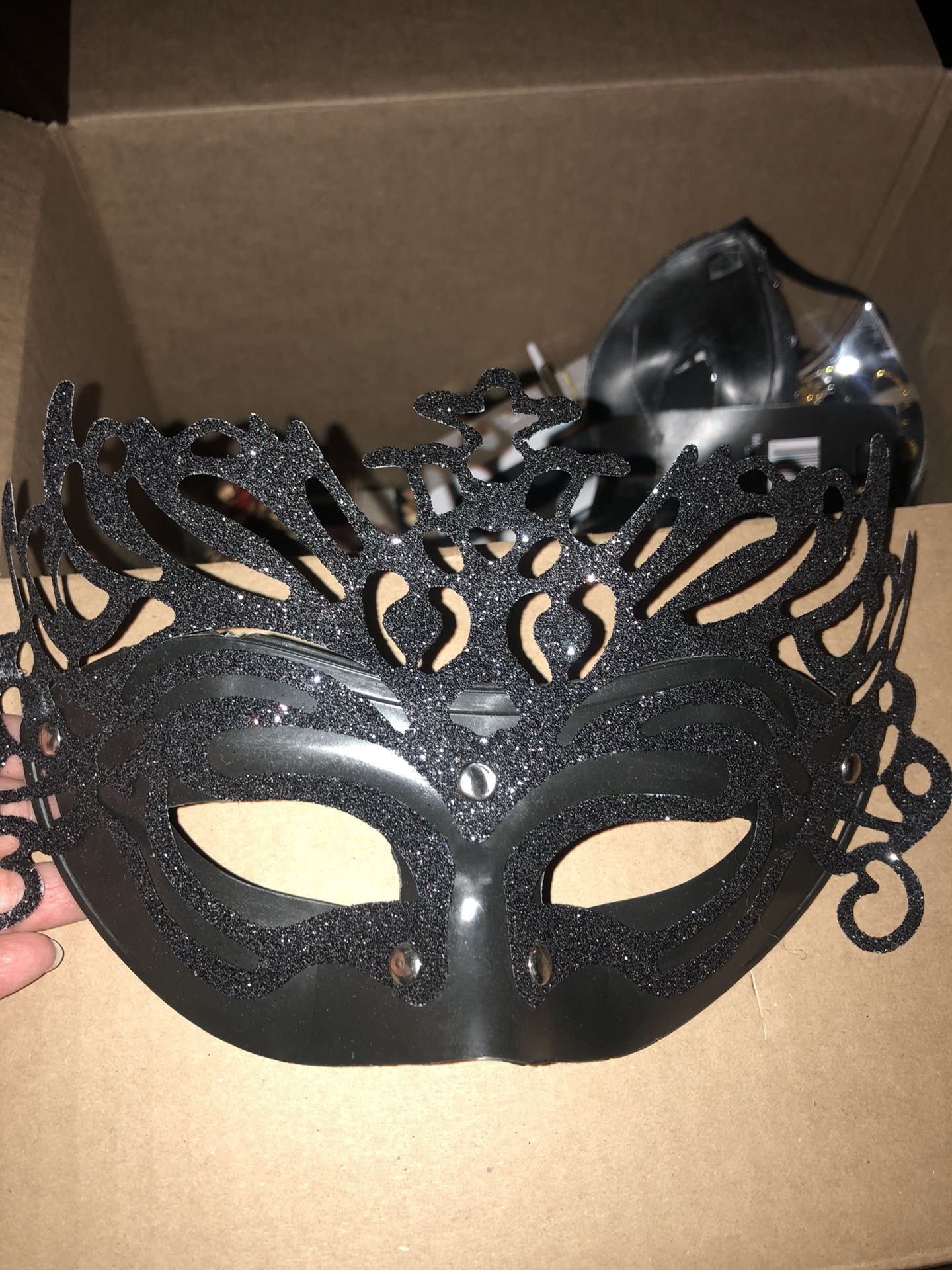 Masquerade mask 10 never used and about 30 only used for displayed. They are black with a bit of glitter and can wear. Perfect for your masquerade pa