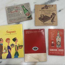 These are vintage advertisement booklets and ephemera for alcohol brands produced by the National Distillers Products Corporation.  Samovar Vodka: A b