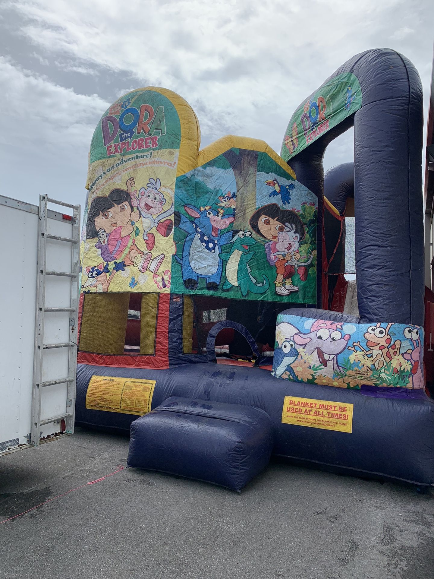 Used Dora the explorer bounce house (read description & see photos