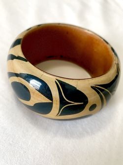 Authentic hand-carved wooden bangle “Eagle” by Haida artist Cory Bullpit. 