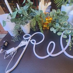 Various decor: lights, candles, garlands, faux plants
