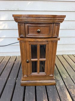 Nice wooden end table with power socket
