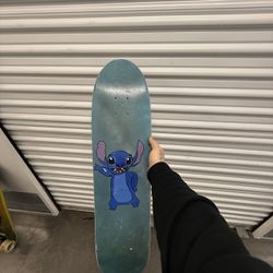 Old school style skateboard with stitch artwork