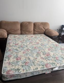 Sofa bed in soft, suede-like fabric, in light beige and brown.