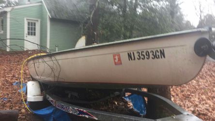 Trailer and sail boat with title